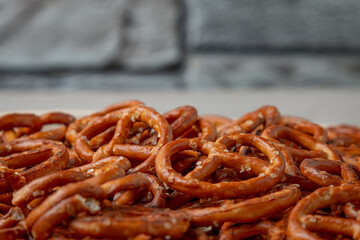 Crispy pretzels on the kitchen table. Ready for a party. Salted crispy pretzels