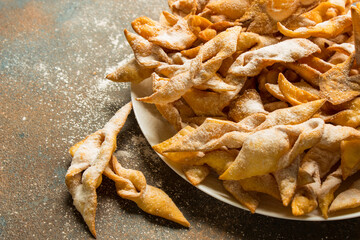 crispy sweet cookies on a white dish on a blue background 