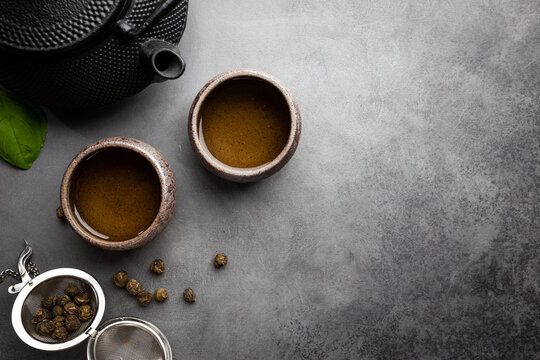 Green Japanese Tea On Black Stone Table. Top View With Copy Space