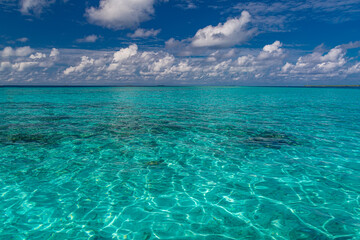 Sea surface summer wave background. Exotic water landscape with clouds on horizon. Natural tropical water paradise. Seascape nature relax. Travel tropical island resort. Ocean nature tranquility