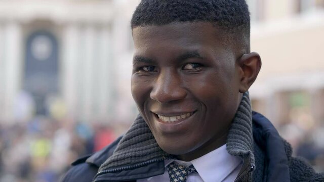 young black businessman  he laughing mischievously at the camera - outdoors