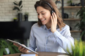 Freelance business women using tablet working call video conference with customer in workplace at...