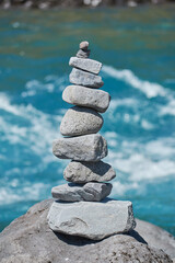PETROHUE, CHILE - FEBRUARY 11, 2020: The waterfalls, rapids and tourists of Petrohue on a sunny day in the lake region of Chile, near of Puerto Varas. Turquoise water. Apachetas