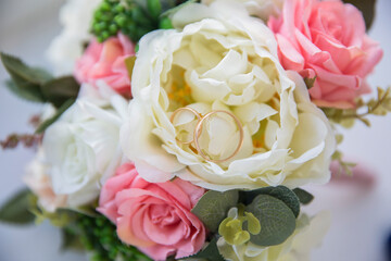 white flower and pink flowers next to each other