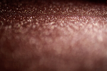 Pink glitter texture abstract background. Defocused bokeh.