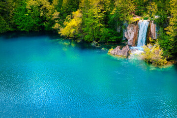 Green blue lake with waterfall in forest, Plitvice Lakes, Croatia