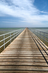 a long bridge goes far into the sea