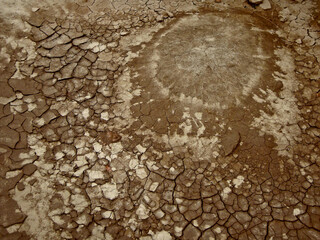 Surface of ground in ancient Zoroastrian fortress Gyaur-Kala near medieval necropolis Mizdakhan, town Xojayli, near Nukus, Uzbekistan. Mud and dirt are remains of ancient buildings literally