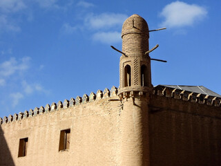 Traditional eastern tower in corner of outer wall of former Khan palace in Khiva, Uzbekistan....