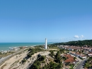Fototapeta na wymiar Panoramic View of Mãe Luiza Lighthouse with Morro do Careca in the background