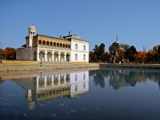 View on pool and on museum of Arts and Krafts in Bukhara, Uzbekistan. Original name of building is Sitorai Mokhi Khosa (Palace of Moon like Stars). In a past it was summer house of last Bukhara Emir.