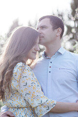 guy kisses a sincere girl on a walk