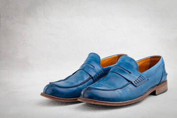 Pair of old leather blue discarded boots with laces