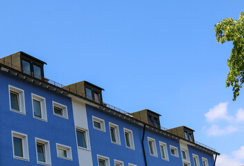 Munich, Germany, June 2020: Blue & White colored building in the backdrop of blue skies on a...
