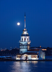 Fototapeta na wymiar Maiden's Tower with moonset fullmoon view. Istanbul, Turkey (KIZ KULESI - USKUDAR)