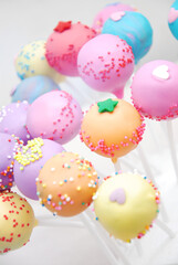 Fototapeta na wymiar colorful cake pop , yellow, blue, pink and purple