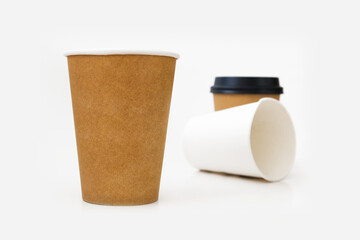 Hot drinking cup. White paper cup on a white background.