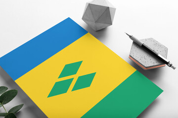 Saint Vincent And The Grenadines flag on minimalist paper background. National invitation letter...