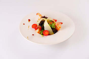 Salad with prawns, cheese, lettuce, tomatoes. White background