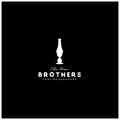 negative space logo wine and the face of a man in a wine bottle