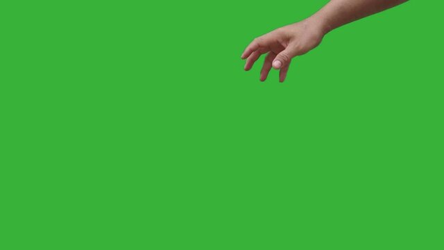 Footage real time human hand gently dropping trash paper isolated on chroma key green screen background. 