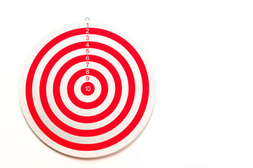 The dartboard is striped red and white on a white background with a copy of the space.