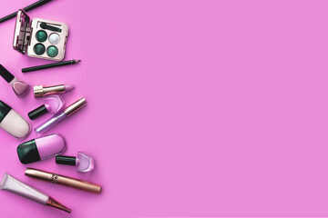 A set of various cosmetics on a pink background