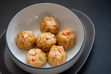 Homemade Chinese steamed shrimp dumpling or Shumai in bowl