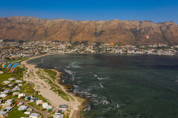 Obraz premium Aerial view of the ocean front community of Gordon's Bay, South Africa