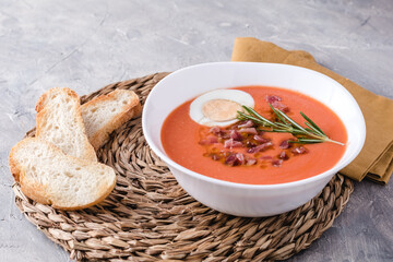 Salmorejo soup, Spanish traditional dish. With Ham And Eggs In A Bowl