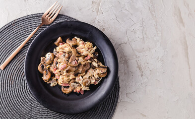 Scrambled eggs with mushrooms and ham. Spanish dish. copy space