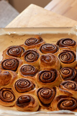 Homemade yeast dough cinnamon rolls, close up image shallow depth of field