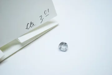 Fototapeten CVD HPHT lab grown rough solitaire diamond with its parcel paper © Chirag