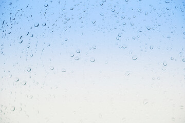Water drops on glass, gradient background. High quality photo