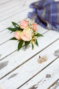 Groom's morning. Wedding accessories. boutonniere and cufflinks in the form of a clockwork