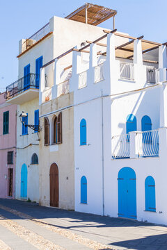Colorful houses on the seafront of Alghero (Sardinia, Italy).