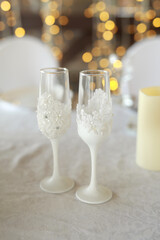 beautiful white wine glasses on the festive table