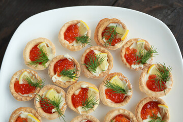 beautiful tasty tartlets with red caviar