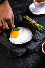 fried egg in a frying panBreakfast, Fried Eggs! Fried eggs. Breakfast for the rich. The most delicious breakfast with coffee