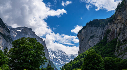 View of Lauterbrunnen valley, the Staubbachfall, and the Lauterbrunnen Wall in Swiss Alps, Switzerland.