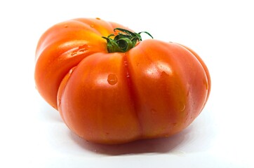 Red raf tomato on white background Fresh vegetable. Healthy eating