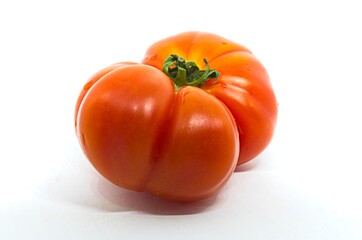 Red raf tomato on white background Fresh vegetable. Healthy eating