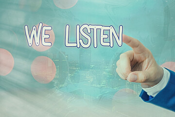 Writing note showing We Listen. Business concept for an organization willing to pay attention by...