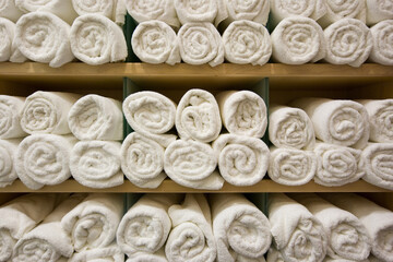 Rolled up towels on gym locker room shelf