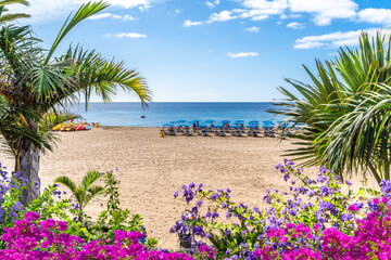 Landscape with Puerto del Carmen beach, Lanzarote, Canary Islands, Spain - obrazy, fototapety, plakaty