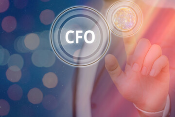 Writing note showing Cfo. Business concept for chief financial officer managing the financial actions of company Elements of this image furnished by NASA