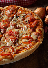 pizza with salami and tomatoes