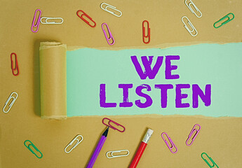 Word writing text We Listen. Business photo showcasing an organization willing to pay attention by...
