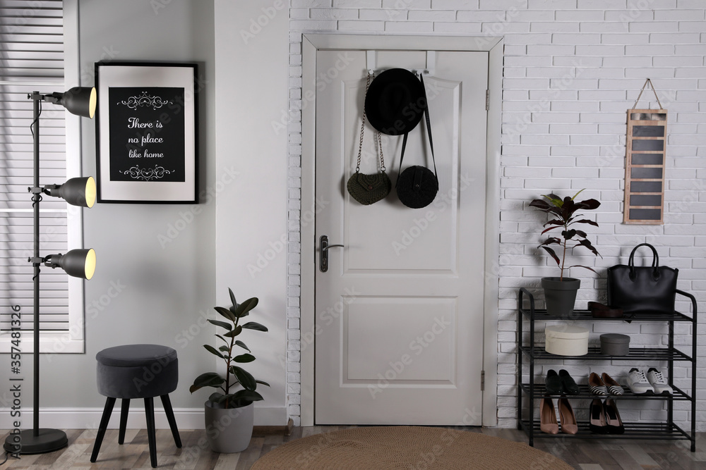 Wall mural Hallway interior with stylish furniture, shoes and plants