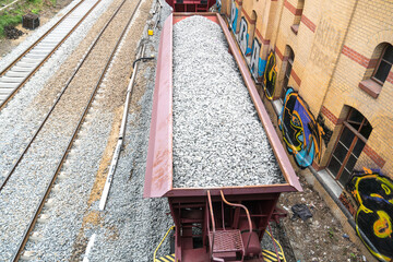 Cargo train with aggregate stones, view from above